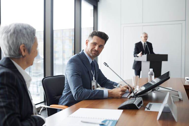 Professionals engaging in a business meeting, showcasing a collaborative corporate environment.